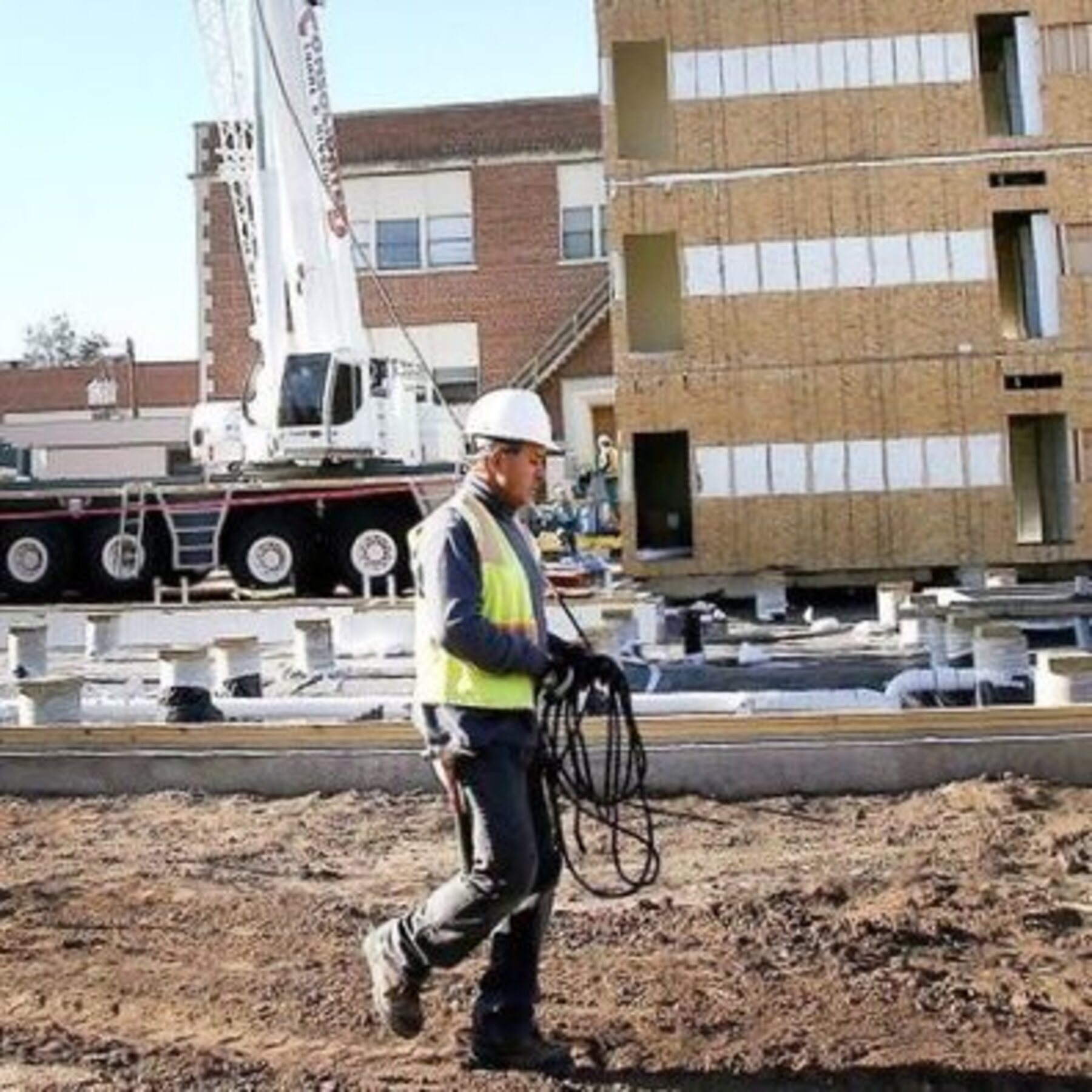 A modular housing unit staged on site before being set by crane